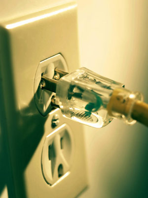 Photo of a plug in a wall outlet