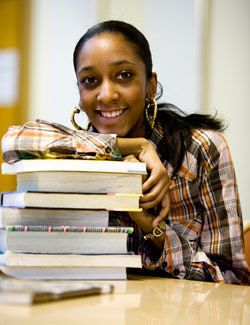 Photo of female student with books Photo of female student with books