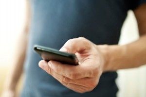 166153695_using-cell-phone-e1430769655958